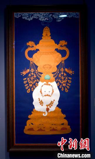 圖為5月16日，展覽中的新創(chuàng)唐卡作品《瑞象承香》?！±盍?攝